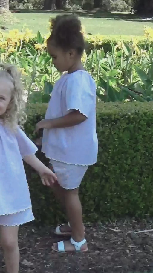 Children wearing Jaxx and Harlow outdoors